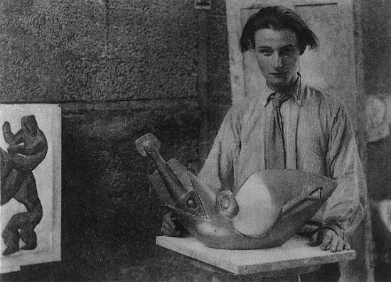 Henri Gaudier-Brzeska with his sculpture ''Bird Swallowing Fish'' in Kettle''s Yard, University of C od English Photographer