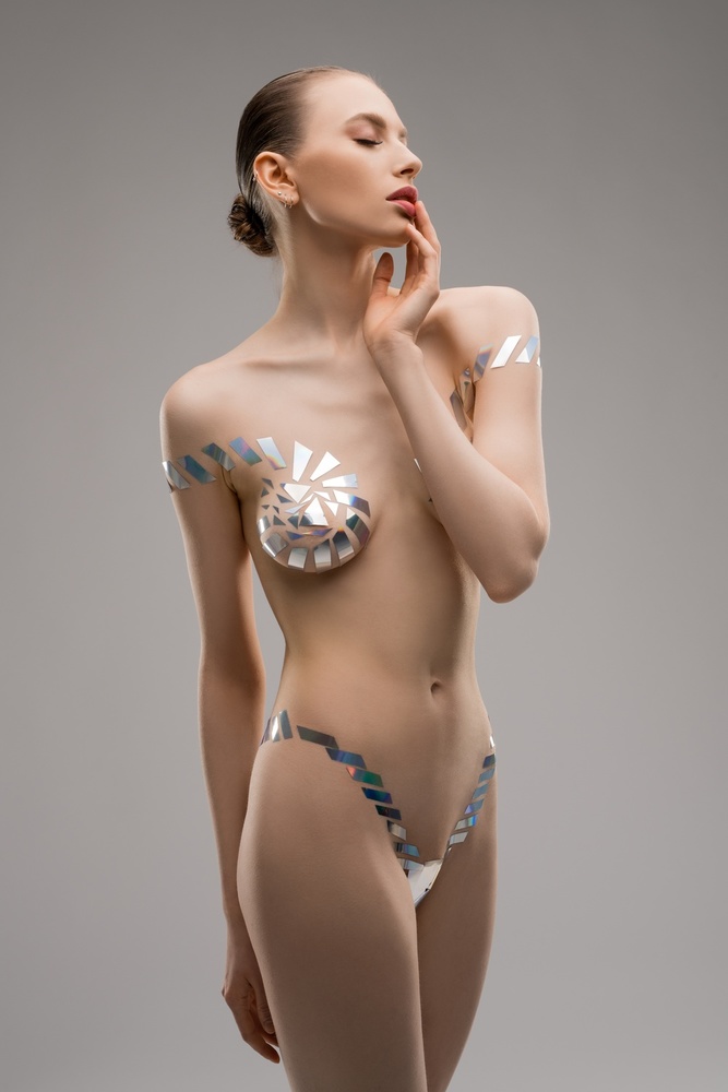 Female model in underwear from metallic tape od Andrey Guryanov