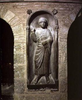 Relief of a man dressed in a toga holding a bookfrom the ambulatory