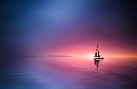 Sailing across the lake toward the sunset