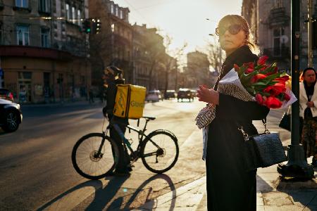 Lady with tulips at sunset