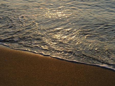 sea waves on the beach at sunset