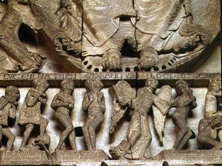 West Portal tympanum depicting the Last Judgement: detail of Christ's feet, an angel and mortals od Gislebertus