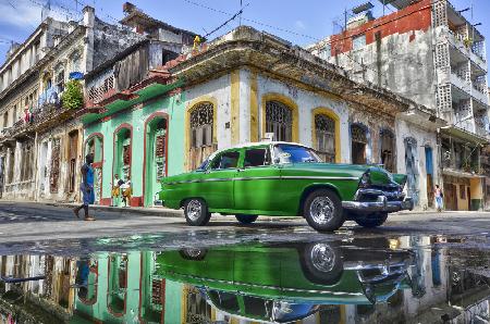 Under a worned green car