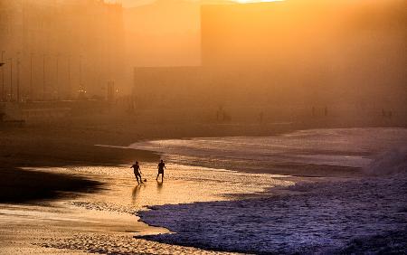 Playing football on the shore