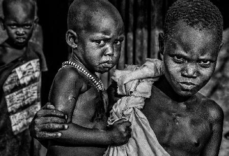 South Sudanian children showing angry expression.