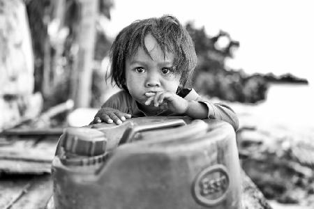 Boy on Oil Can