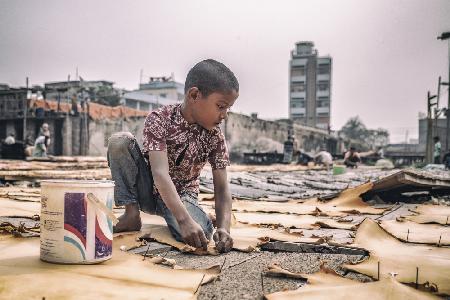 Boy from leather manufacture