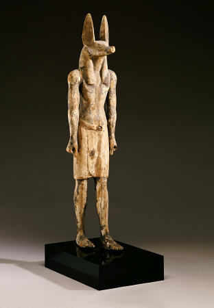 An Egyptian Wood Figure Of A Jackal-Headed Deity od 