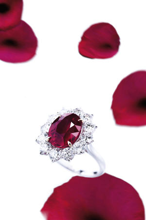 A Superb Ruby And Diamond Ring With An Oval-Shaped Ruby Weighing 8 od 