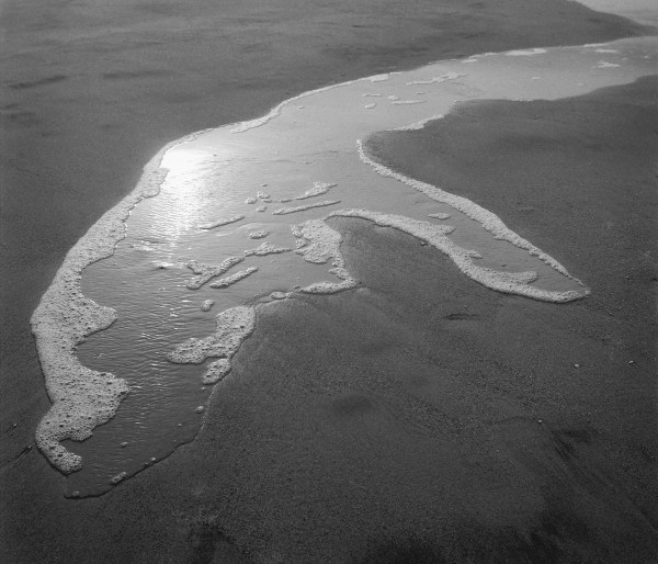 Foam water on sand, Porbandar (b/w photo)  od 