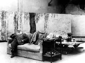 French painter Claude Monet in his workshop in front of one of his paintings Waterlilies