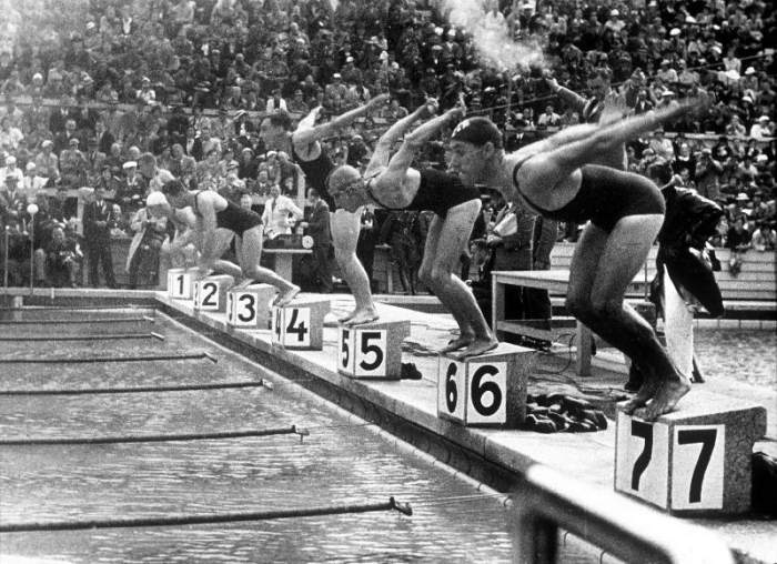 swimming competition at berlin Olympic Games: here swimmers diving in swimmming pool od 