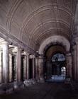 The atrium, with red granite columns and a coffered barrel vaulted ceiling, designed by Antonio da S