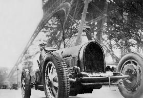 The French writer Paul Morand at the foot of the Eiffel Tower