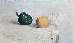 Pepper and Lemon on a White Tablecloth