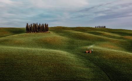 Busy tractor in Val dOrcia