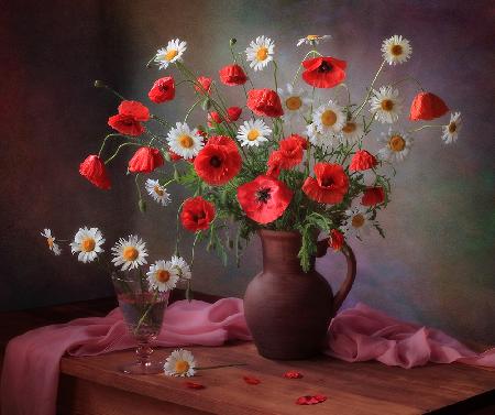 Still life with a bouquet of poppies and chamomile