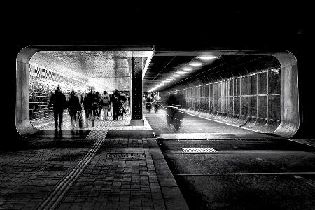 Hasty people on a Friday evening in the tunnel.